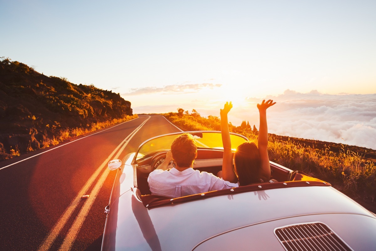 Couple taking a day trip driving down the highway