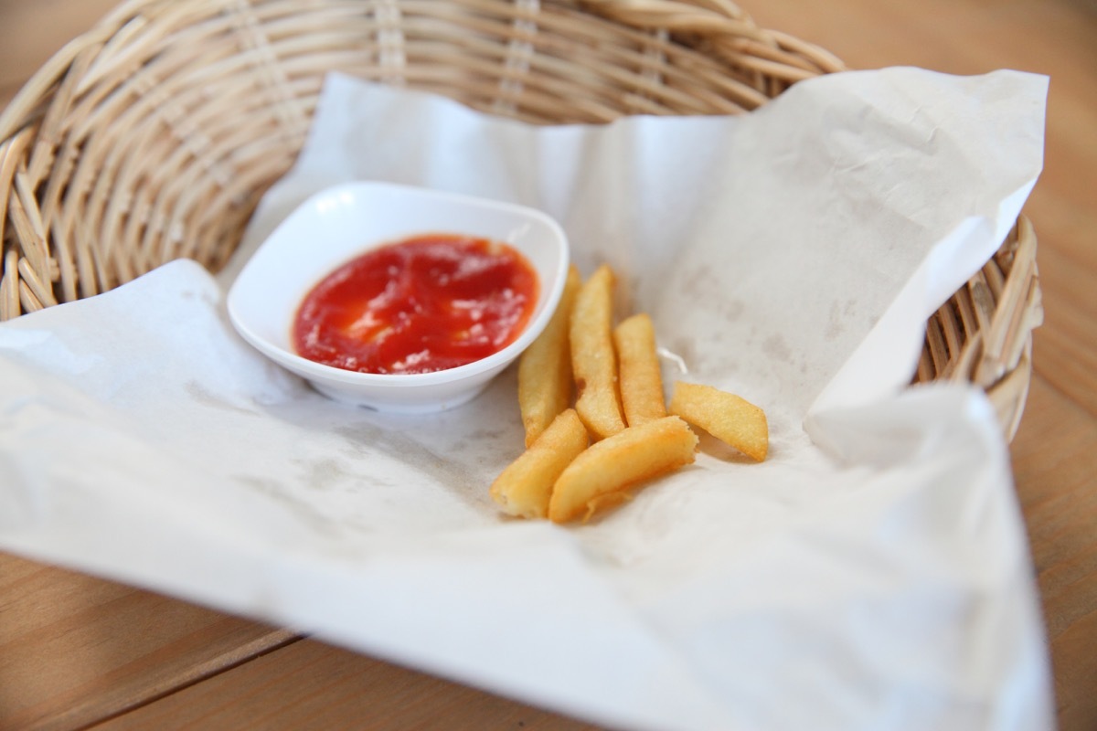 leftover french fries with a little tiny bit of ketchup