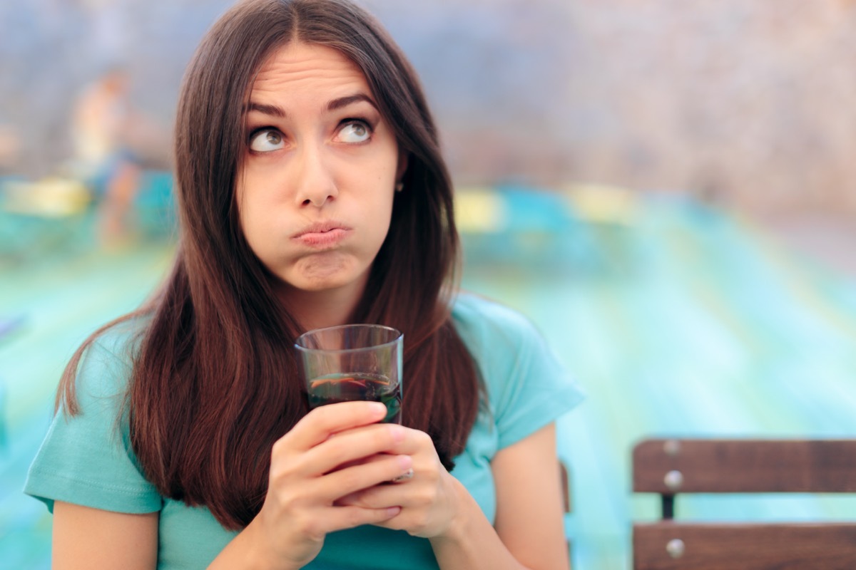 Woman with Soda Glass in a Restaurant