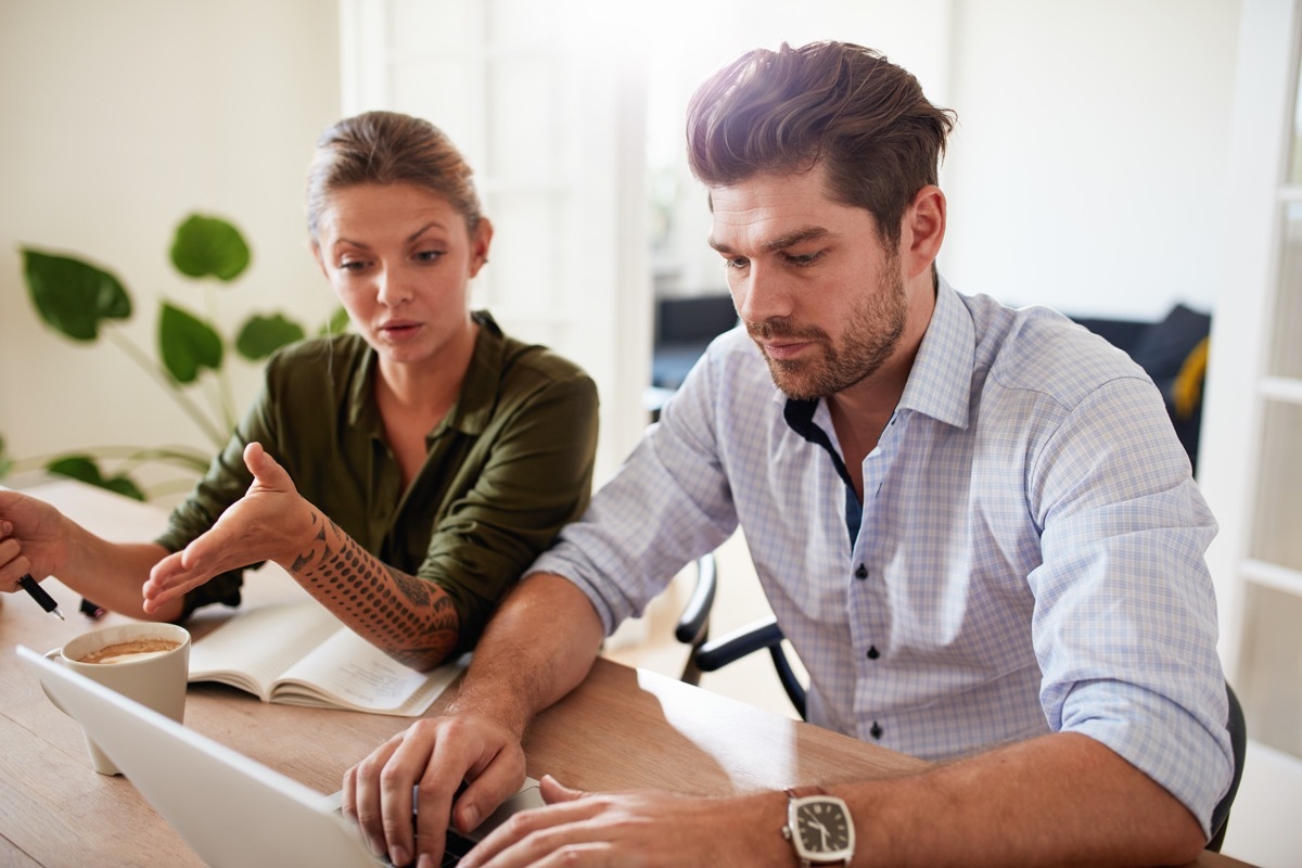 Couple working from home together with tension