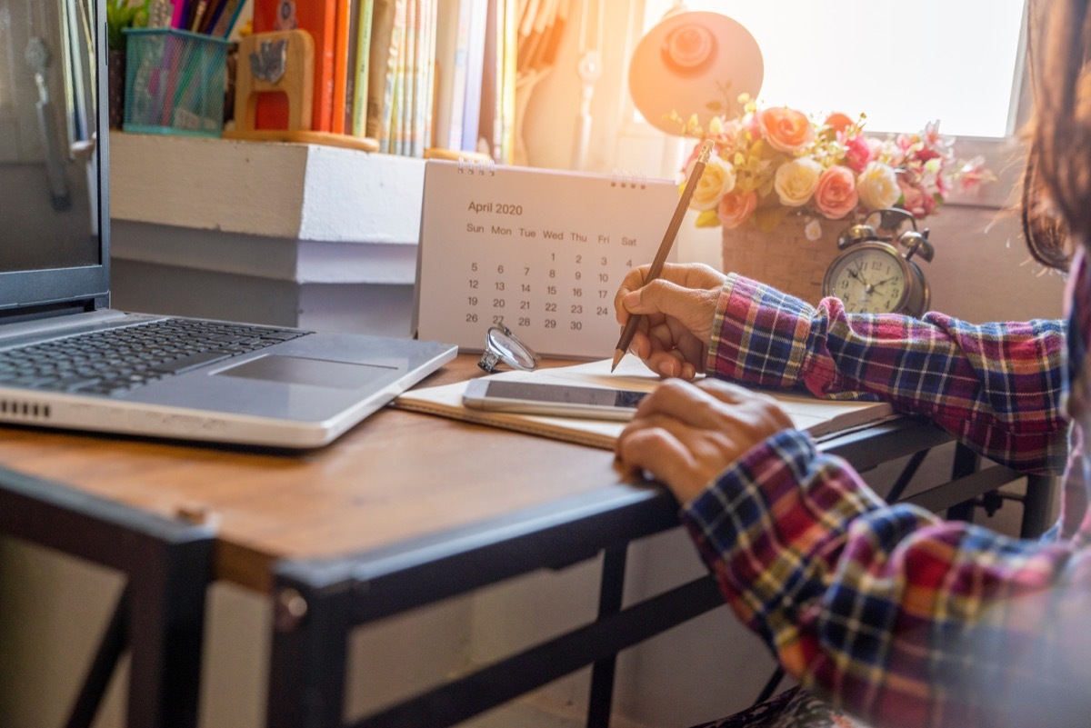 Girl writing in planner