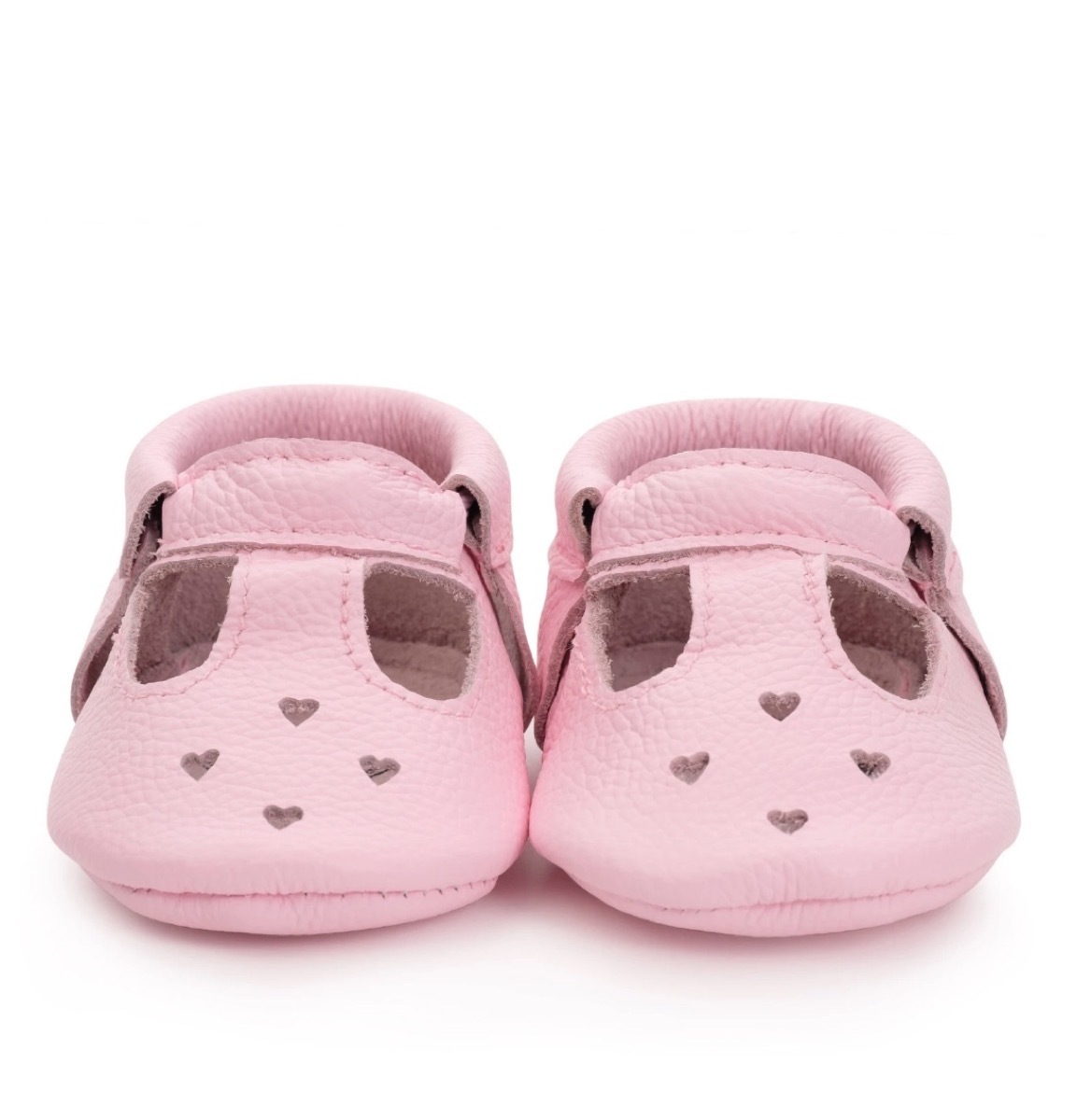 pink baby moccasins with heart cutouts