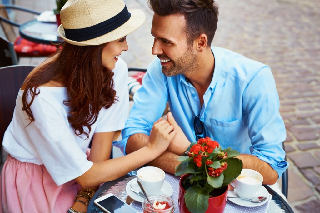 happy couple at sidewalk cafe, open marriage