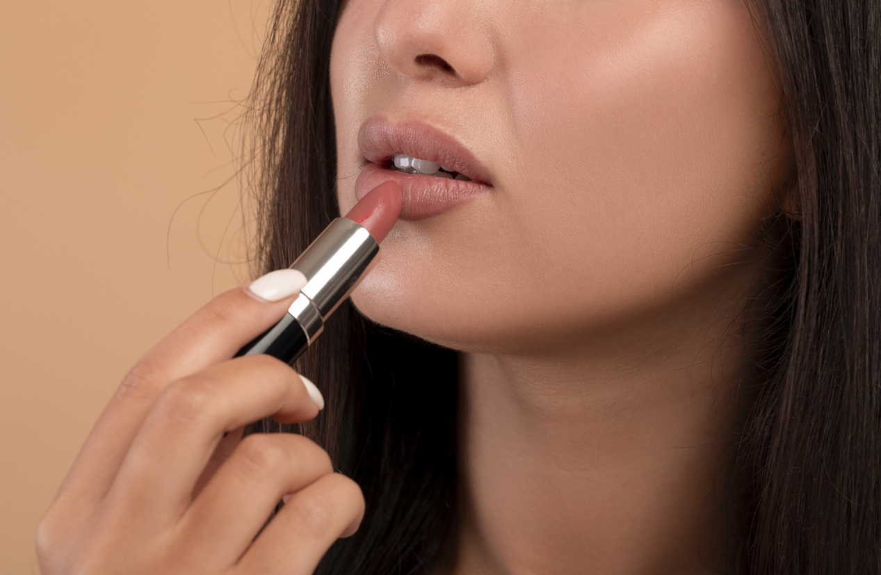 nude lips being applied