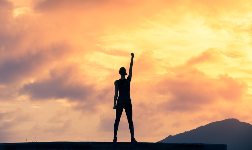 woman climbing mountain