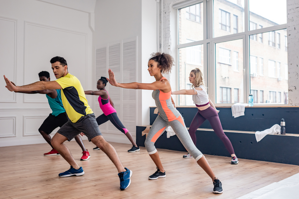 Multicultural dancers training zumba in dance studio