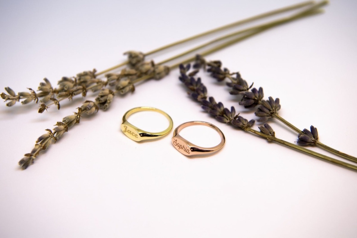 Yellow and rose gold name rings with flowers