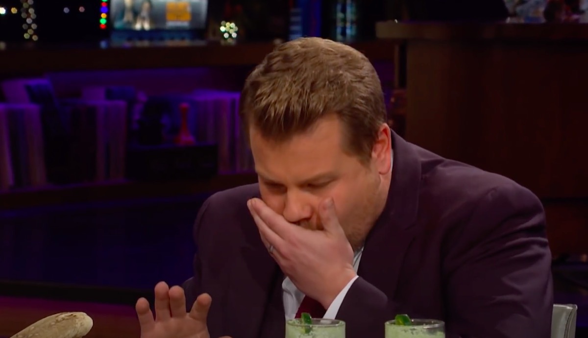 James corden about to spit out food on Spill Your Guts