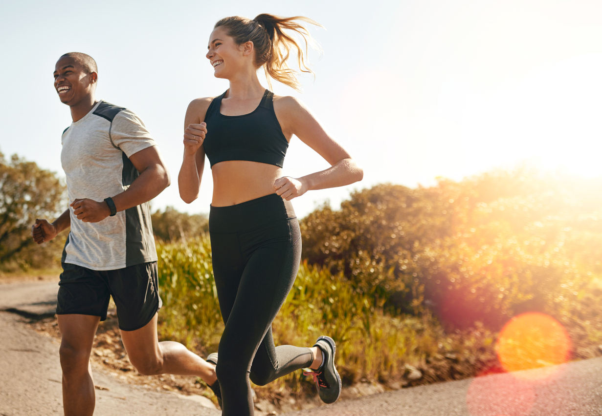 Couple going for a run outdoors.