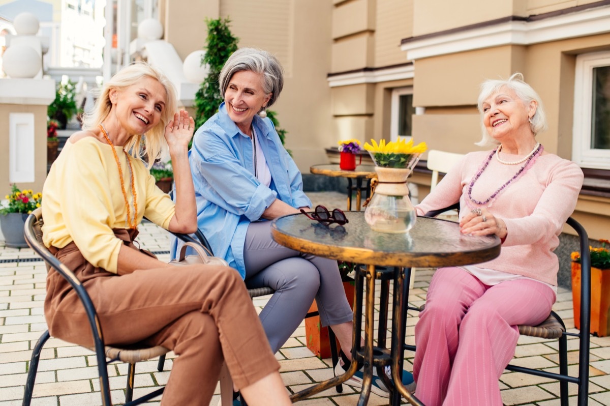 senior women at cafe wearing pastels