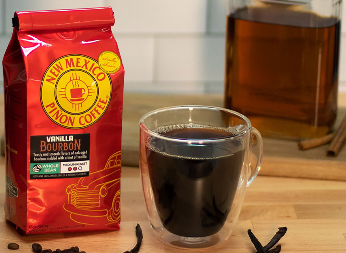 bag of coffee beans with clear mug of coffee