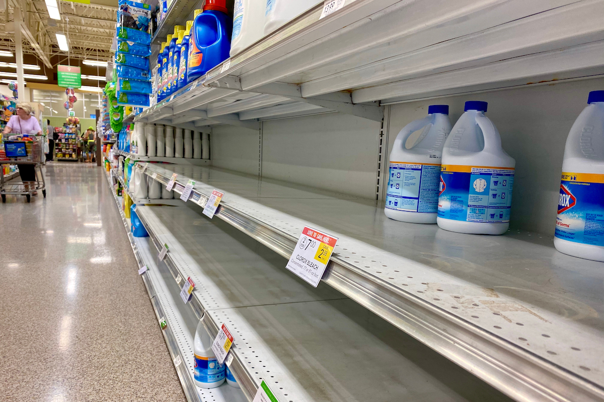 few bottle of bleach left on shelves in super market