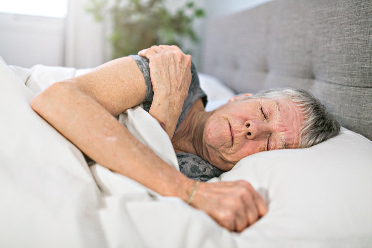 senior woman sleeping in bed