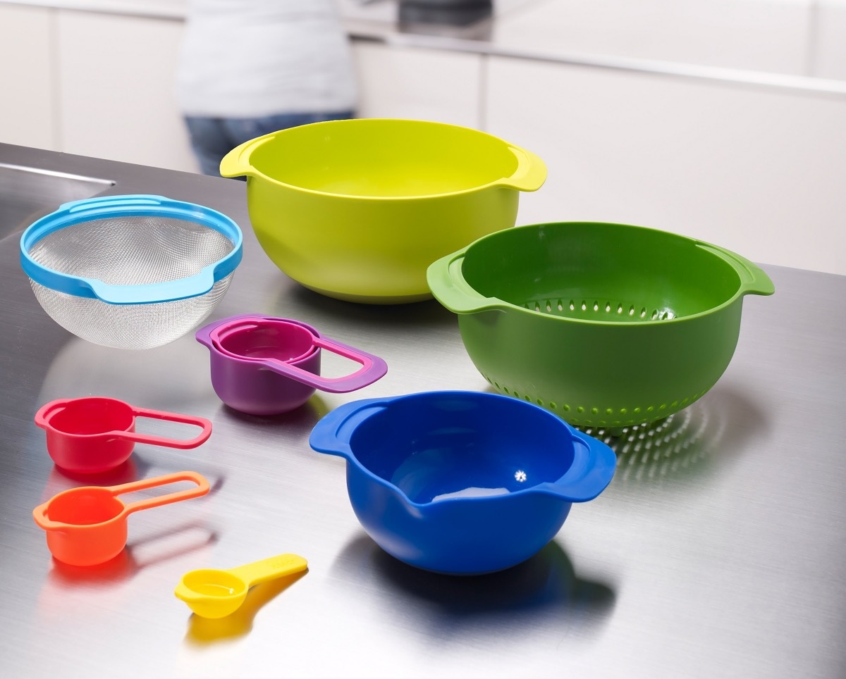 set of green and blue nesting bowls with multicolored measuring cups, hanukkah gifts