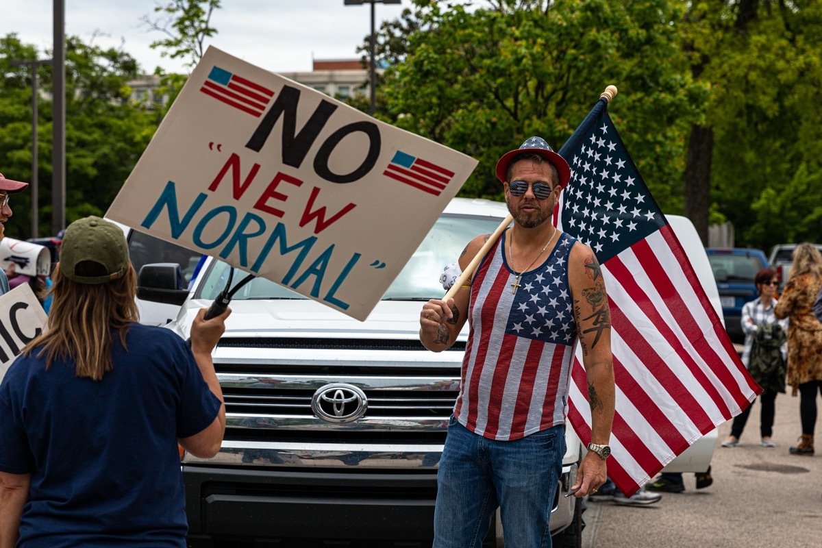 protesters converge downtown Raleigh, NC to protest COVID-19 restrictions and appeal to reopen businesses