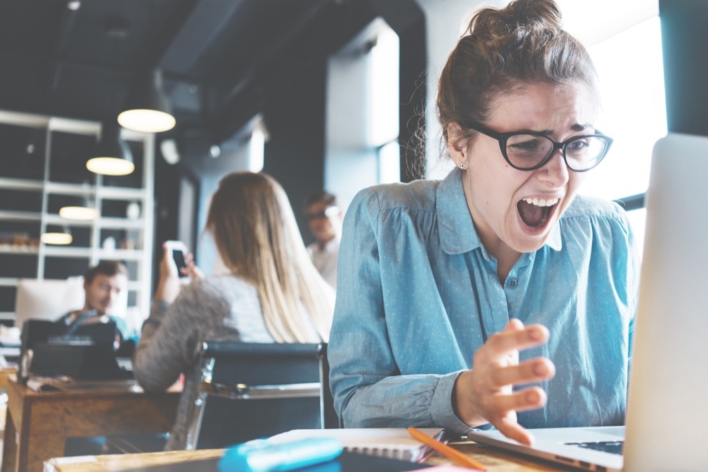 mindfulness stressed out woman at desk yelling work worse skin 