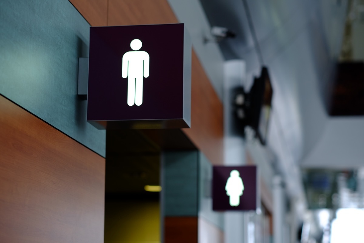 entrance to the male and female toilet. Sign in airport.