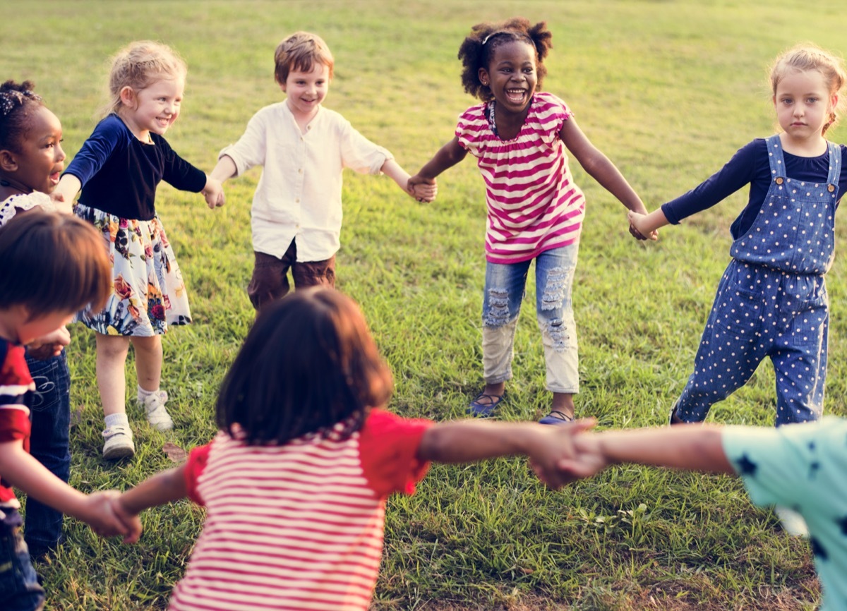 kids playing outside in a circle