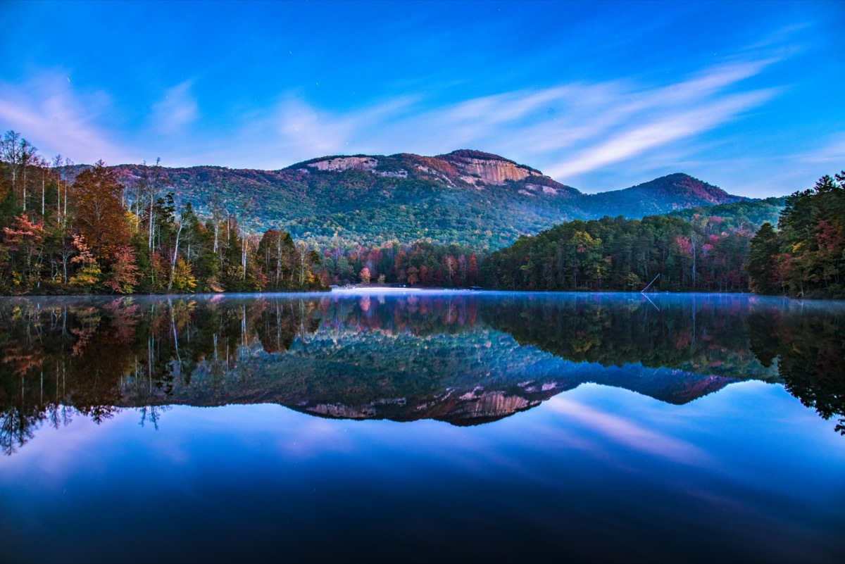 mountains and trees along Pinnacle Lake in Greenville, South Carolina at sunet