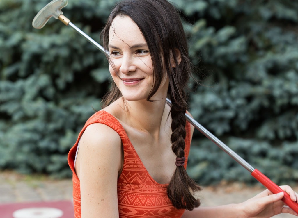 woman happy mini golfing