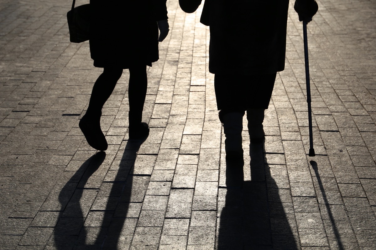 elderly couple walking on the street in one of the worst us cities for retirement