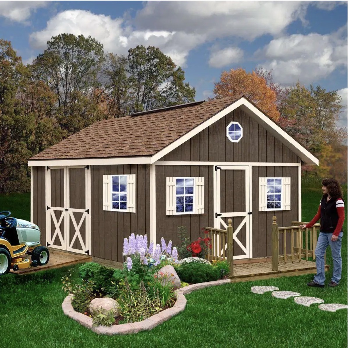 A constructed tiny home with a person standing out front