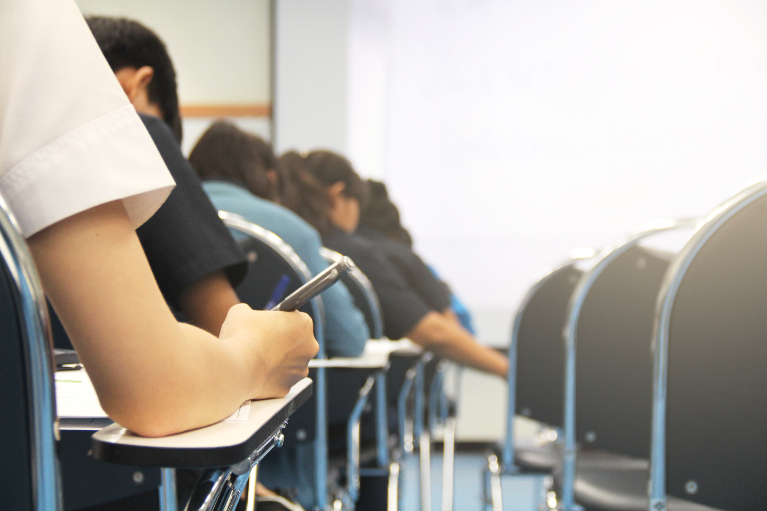 student on phone in classroom