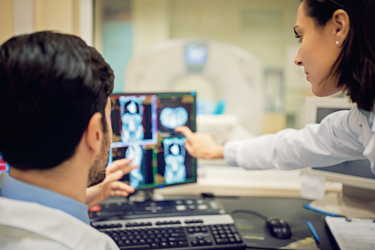 Doctors looking at scan in the hospital.