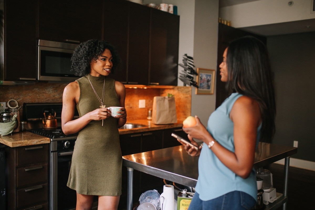 two young women talking to each other