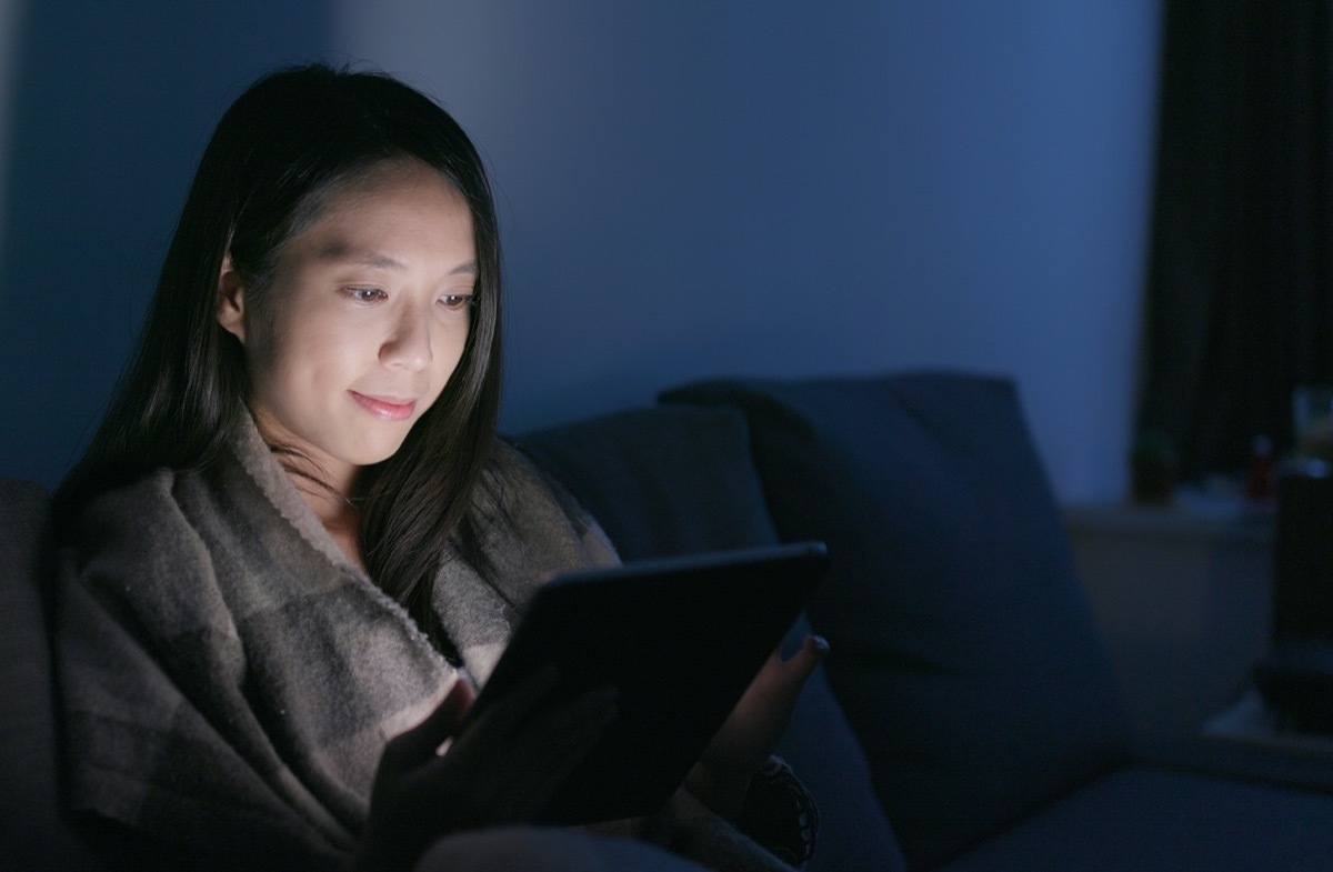 Woman look at tablet computer at home