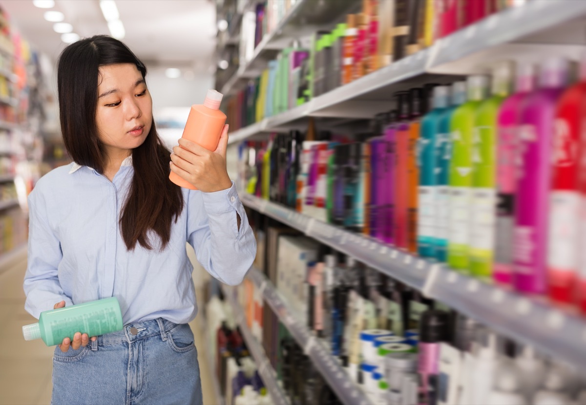 Woman at the store buying shampoo