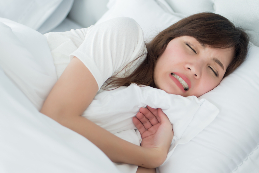 Woman Grinding Teeth at Night Things That Would Horrify Your Dentist