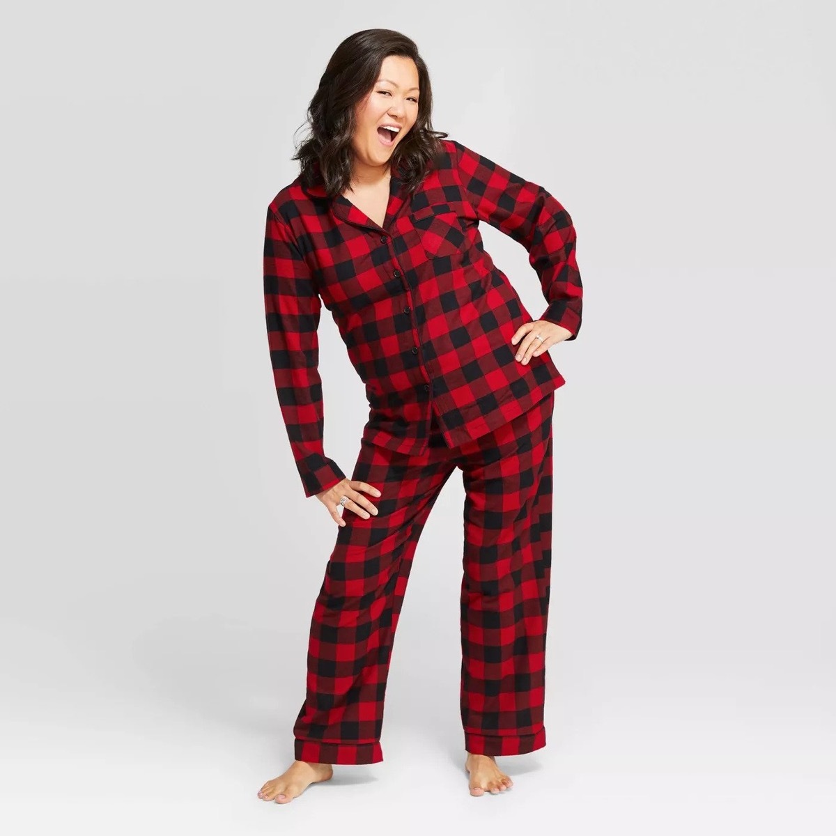 30-something asian woman in red and black pajamas