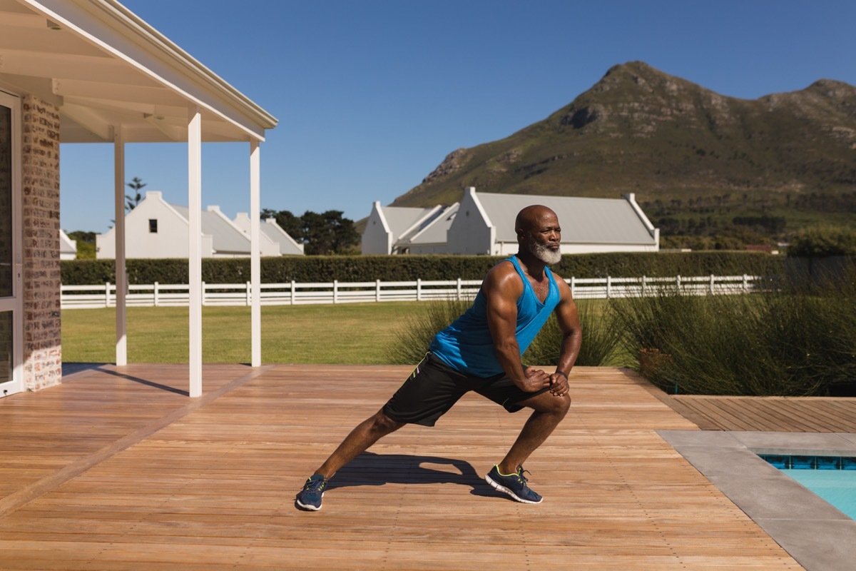 man working out at home, over 40 fitness