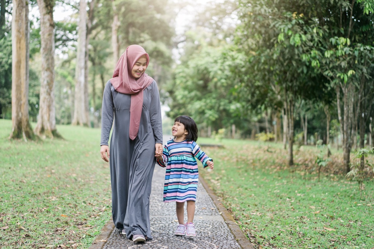 Mother daughter walking together