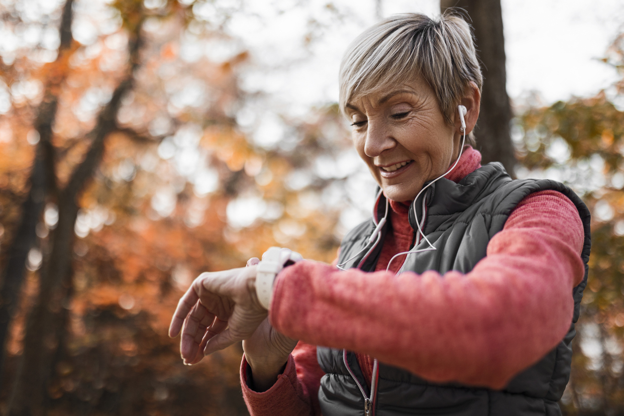 Older woman checking pulse after exercise.