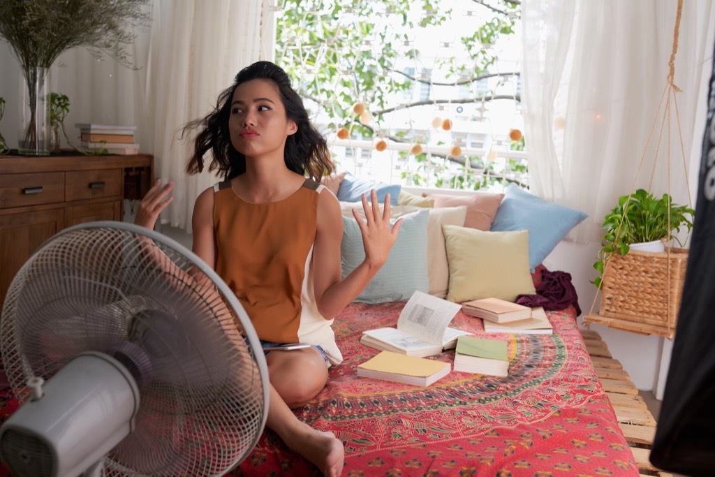 woman sweating in bed things you're doing that would horrify sleep doctors