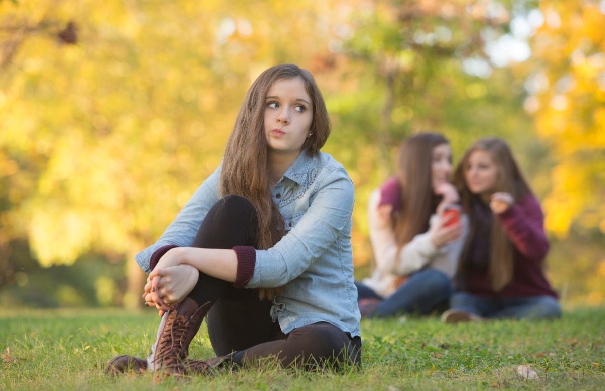 Girl Sitting Alone in a Park