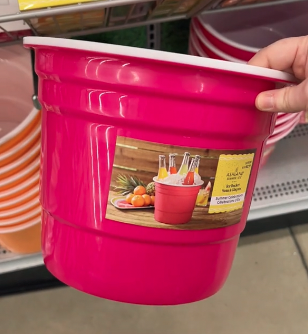 shopper holding up pink ice bucket at Michaels