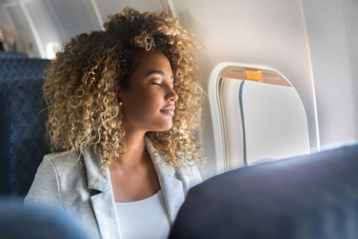 Woman sleeping on an airplane