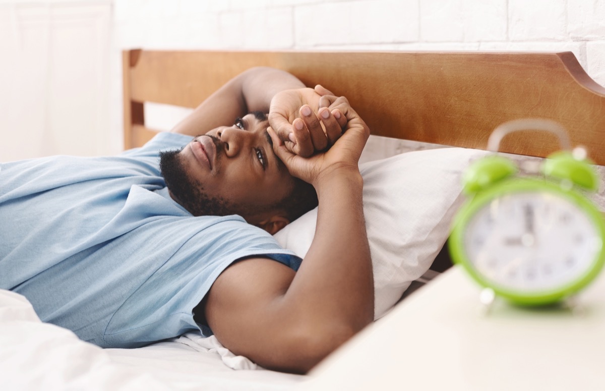 tired man with his head on pillow