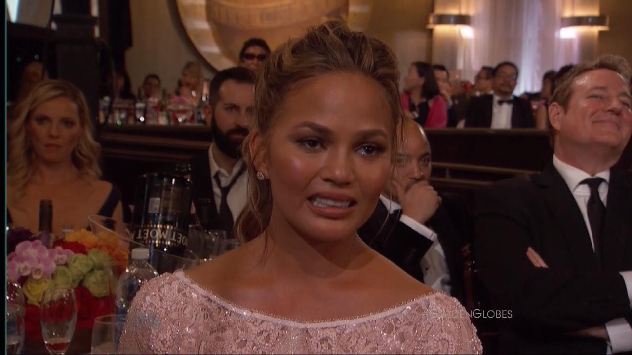 chrissy teigen grimace at the golden globes