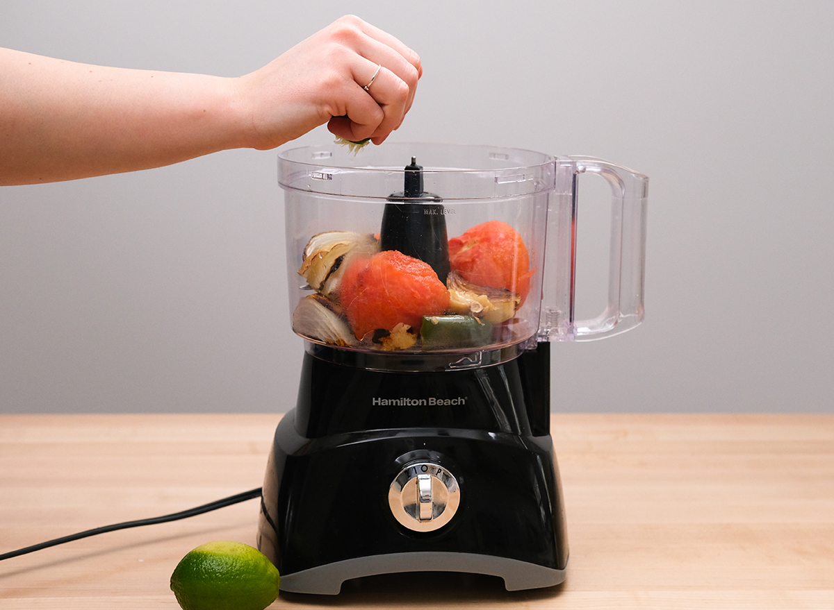 squeezing lime into a food processor