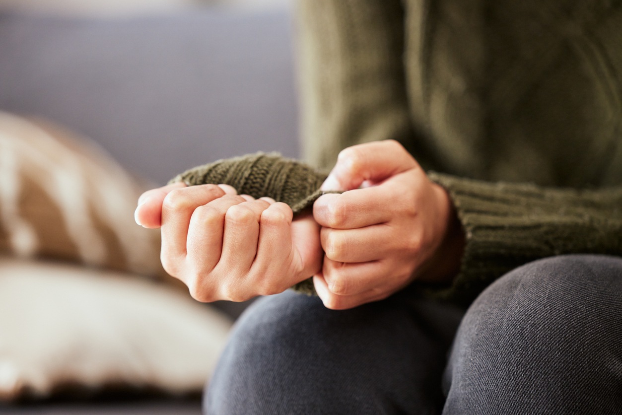 Woman hands clenching into fists. 