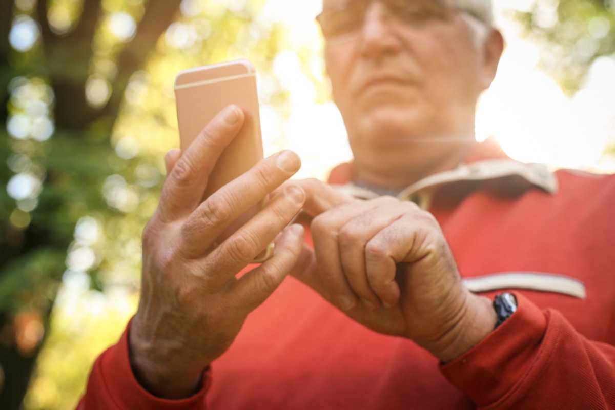 man outside on phone