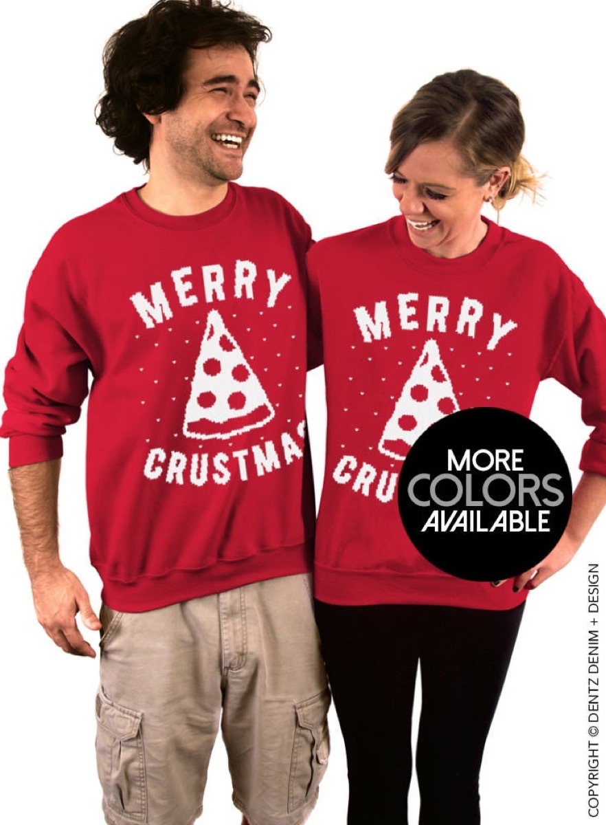 man and woman wearing red sweaters with 