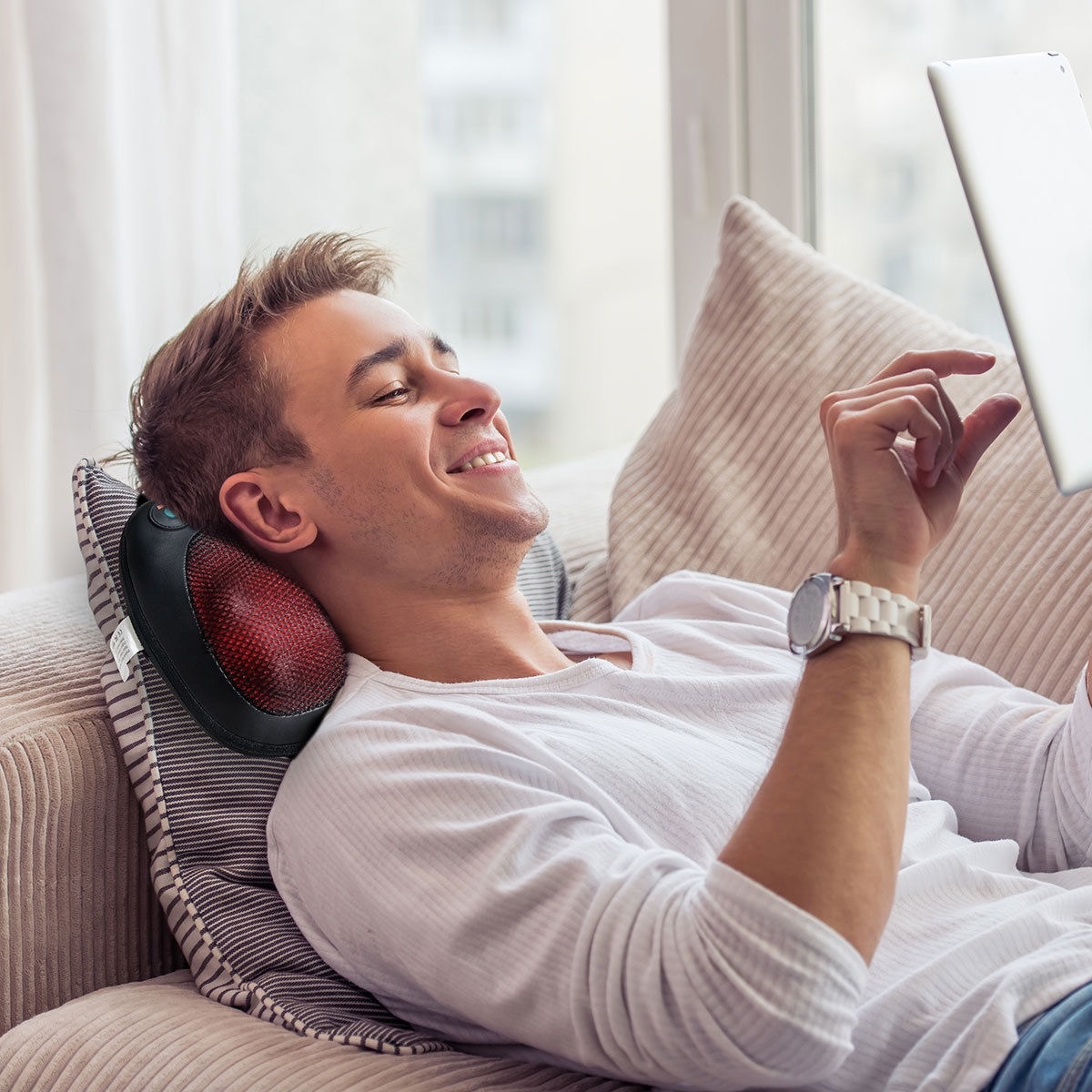 Man using shiatsu pillow massager