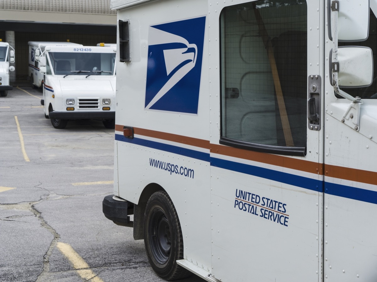 Delivery vehicles parked at the United States Post Office in downtown Rochester, Michigan. With almost 600,000 employees, the United States Postal Service is the second largest civilian employer in the United States.