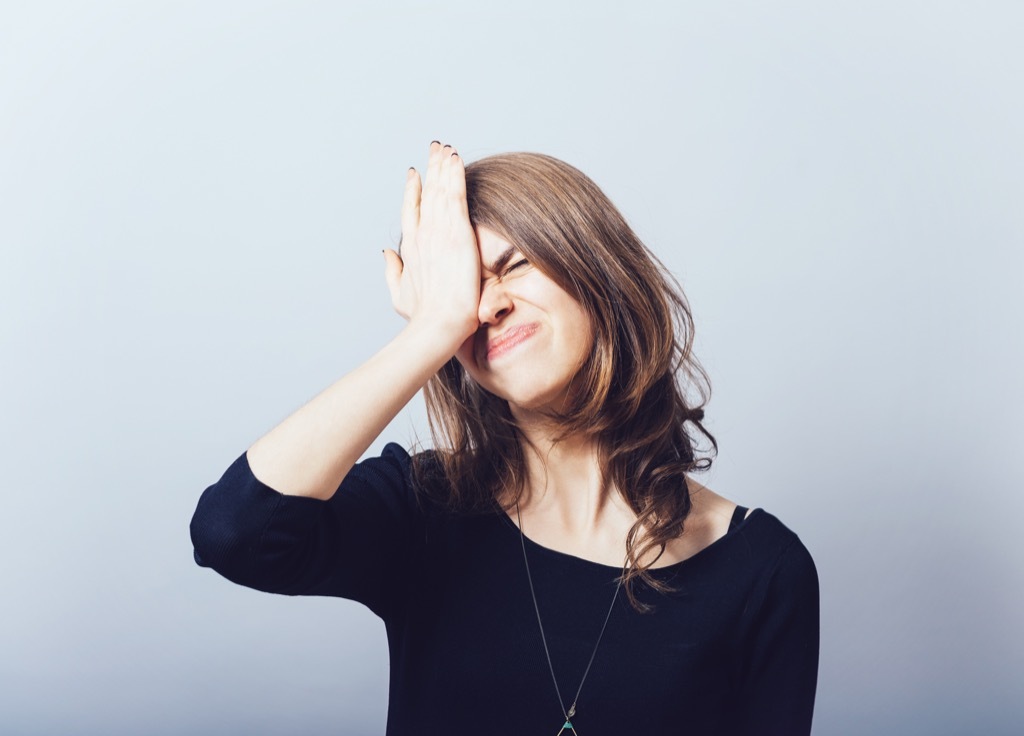 forgetful woman against a gray background