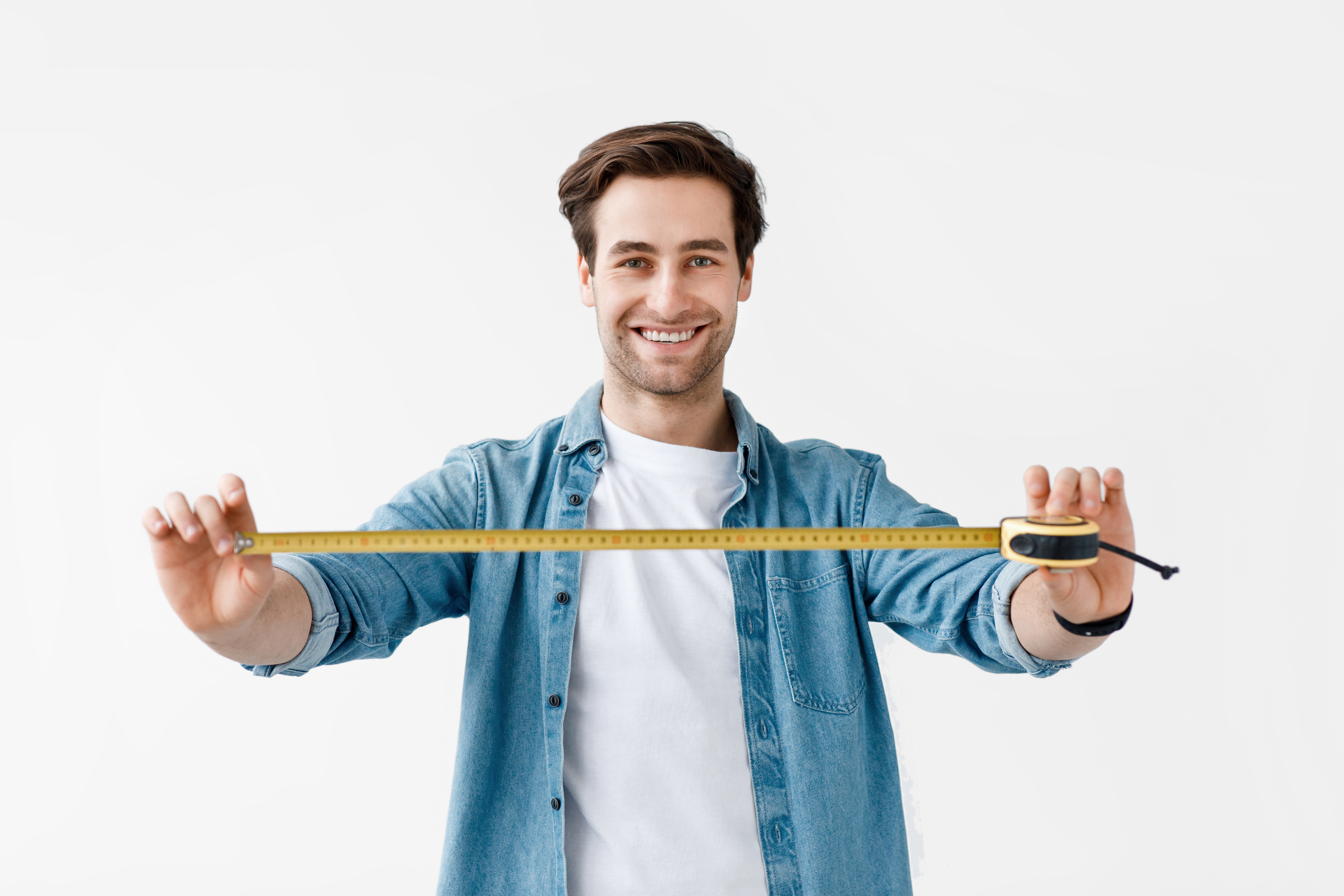 man with tape measure for DIY project